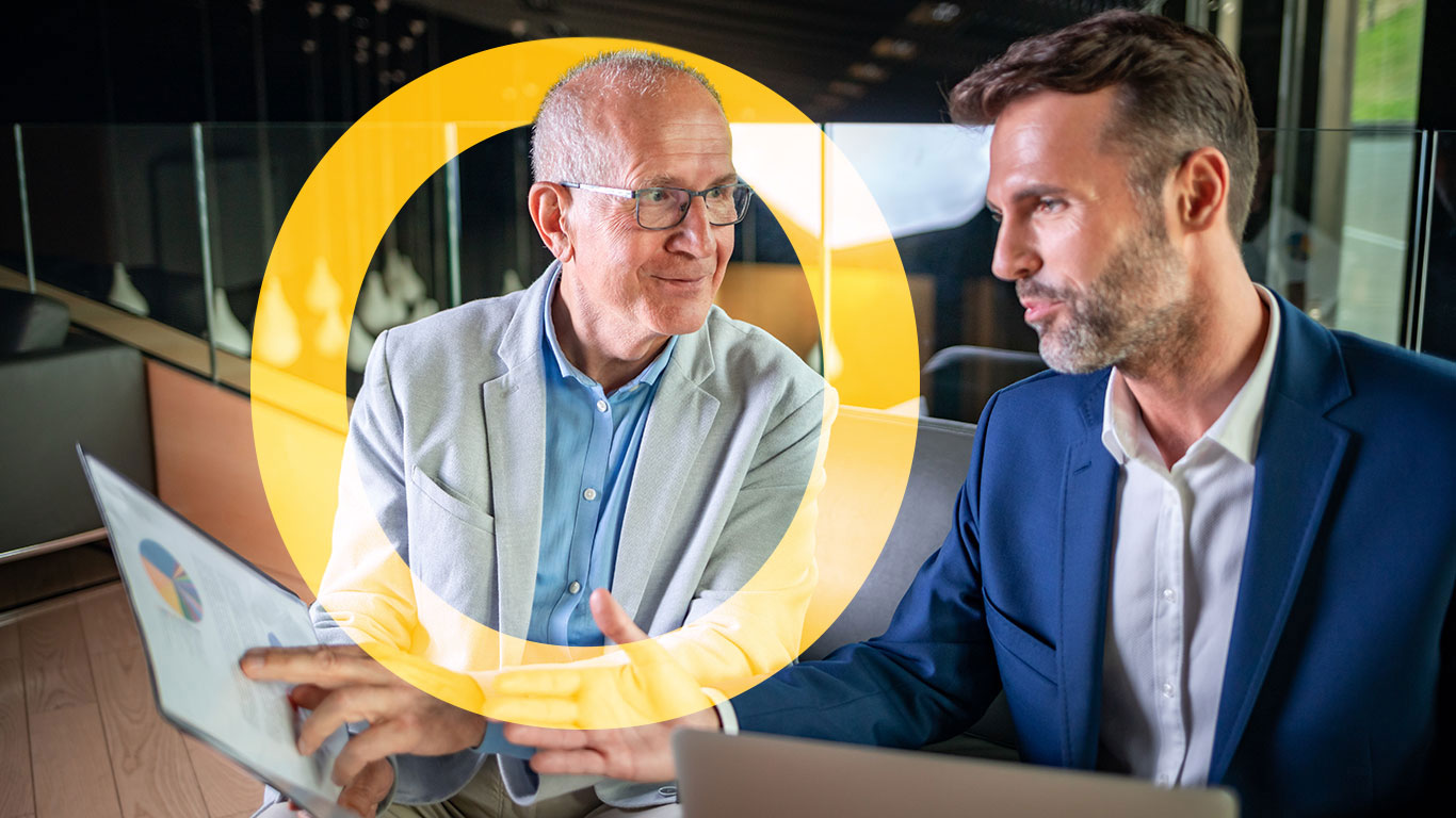 oplyst image - younger-and-older-businessman-talking-about-docume-2021-08-29-16-27-13-utc